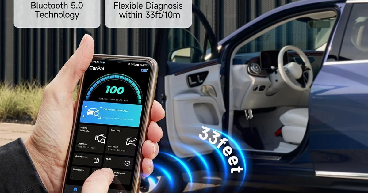 Driver reviewing live diagnostic data on a phone paired with a CarPal OBD2 scanner before an MOT